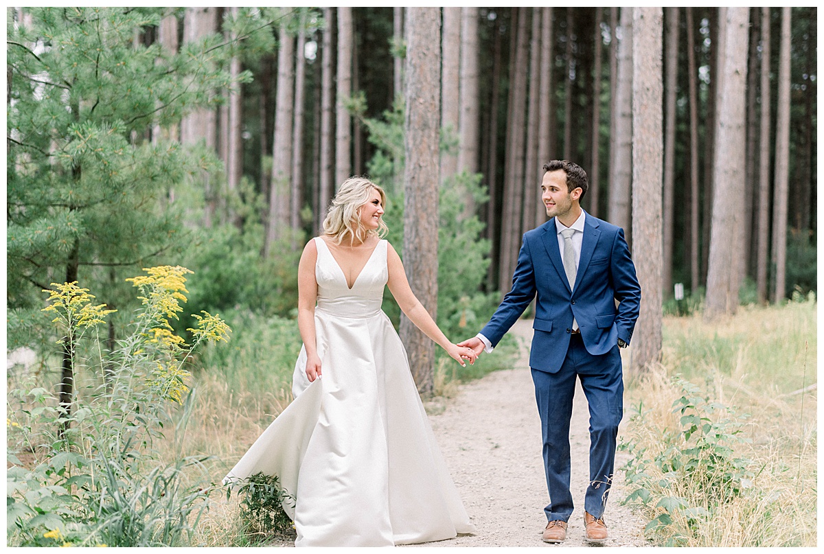 Newlyweds dancing in the woods
